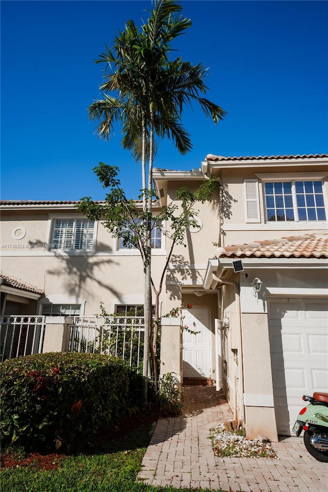 view of front of home with a garage