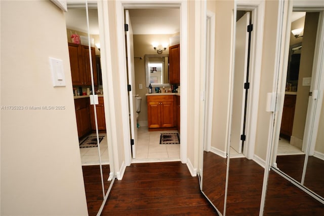 corridor featuring dark hardwood / wood-style flooring