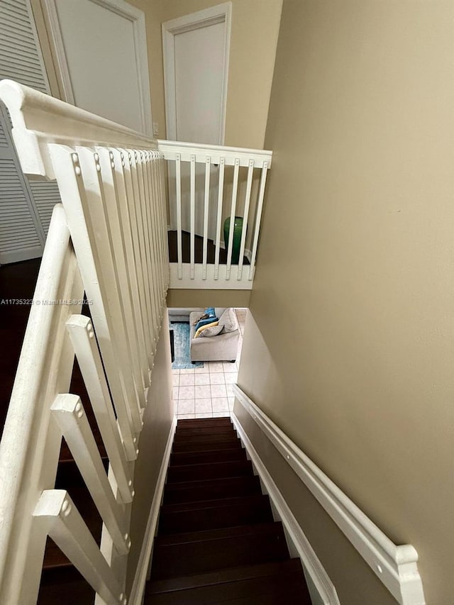 staircase featuring hardwood / wood-style flooring