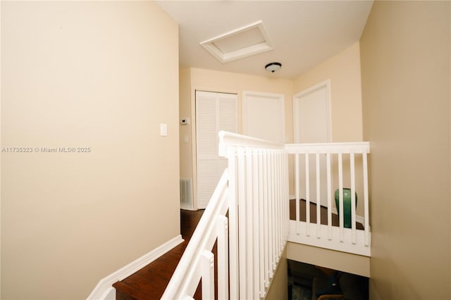 stairway featuring hardwood / wood-style floors