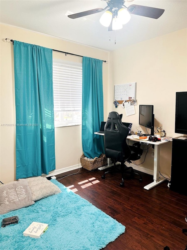 bedroom featuring dark hardwood / wood-style floors and ceiling fan