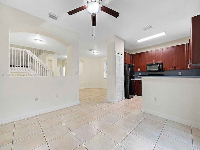 kitchen featuring light tile patterned floors, black appliances, and ceiling fan