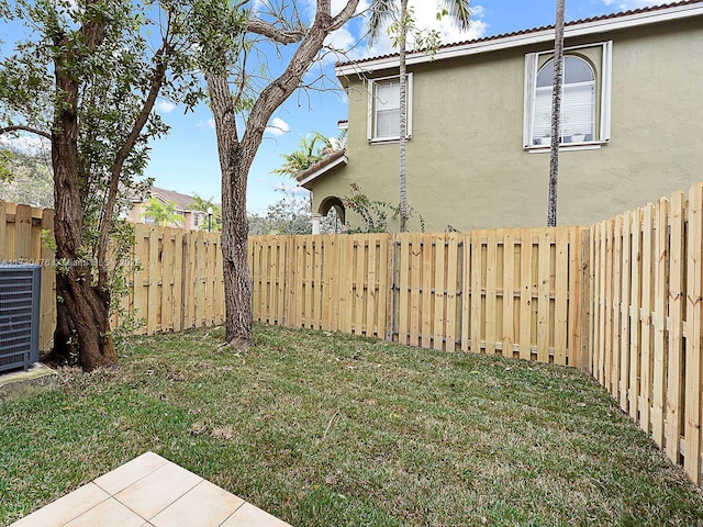 view of yard with central AC