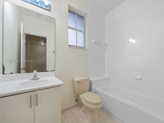 full bathroom featuring vanity, toilet,  shower combination, and tile patterned flooring