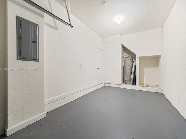 garage featuring electric water heater and electric panel