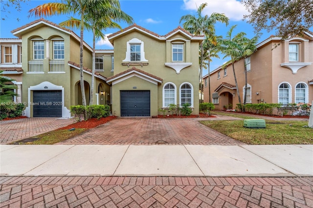 mediterranean / spanish-style home featuring a garage