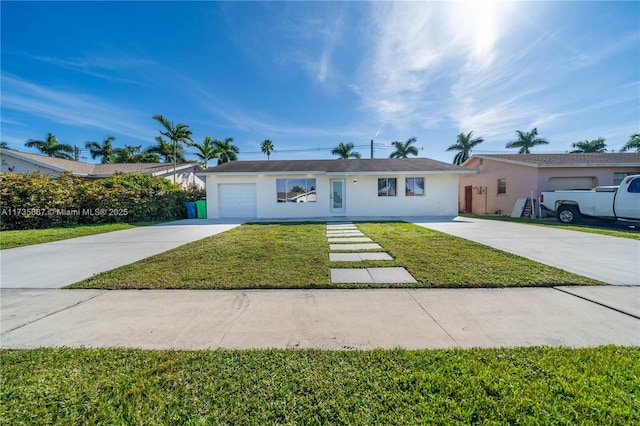 ranch-style home with a garage and a front lawn