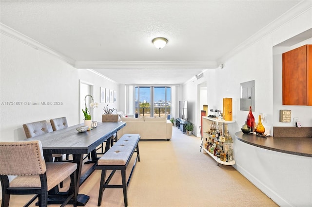 dining area with light colored carpet, ornamental molding, electric panel, and a textured ceiling