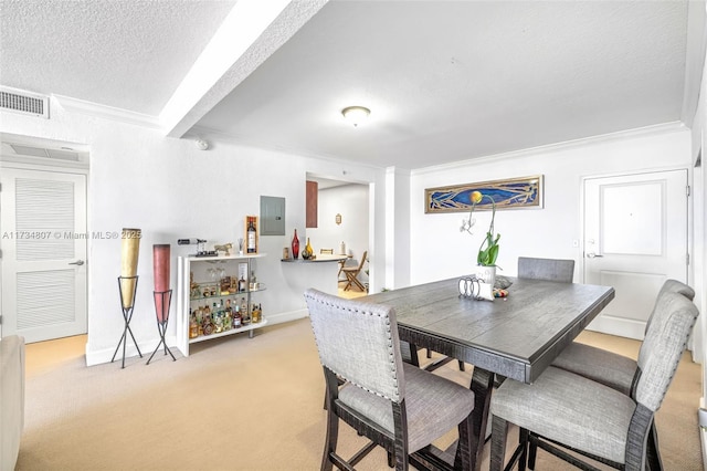 carpeted dining space featuring crown molding, electric panel, and a textured ceiling