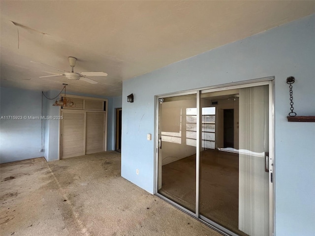 empty room with carpet and ceiling fan