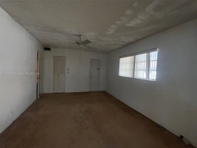 spare room featuring a textured ceiling