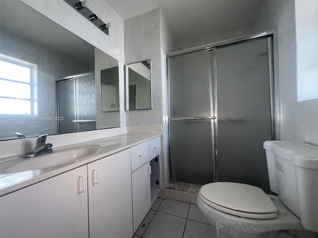 bathroom with vanity, an enclosed shower, tile patterned floors, and toilet