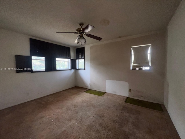 unfurnished room featuring carpet floors and ceiling fan