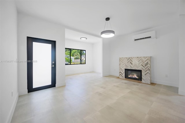 unfurnished living room featuring a tiled fireplace and a wall mounted air conditioner