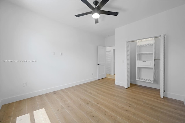 unfurnished bedroom featuring ceiling fan, light hardwood / wood-style floors, and a closet