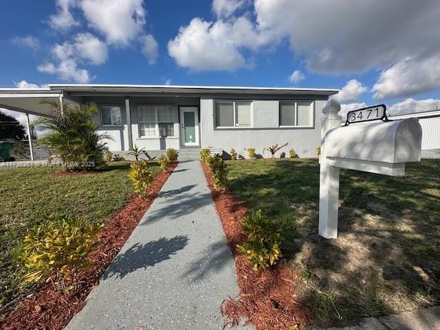 view of front of house with a front lawn