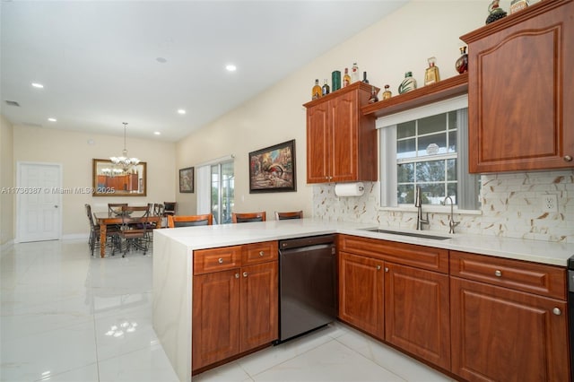 kitchen with sink, black dishwasher, a healthy amount of sunlight, decorative light fixtures, and kitchen peninsula