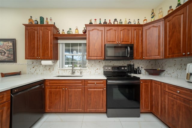 kitchen featuring dishwasher, electric range oven, sink, and backsplash