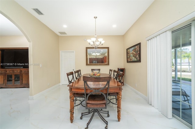 dining space featuring a chandelier