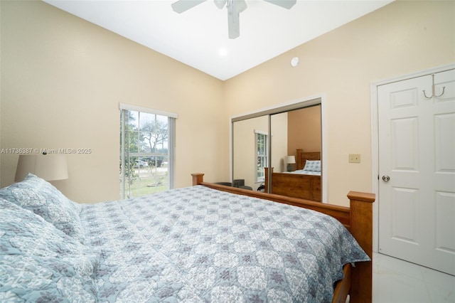 bedroom featuring ceiling fan, vaulted ceiling, and a closet