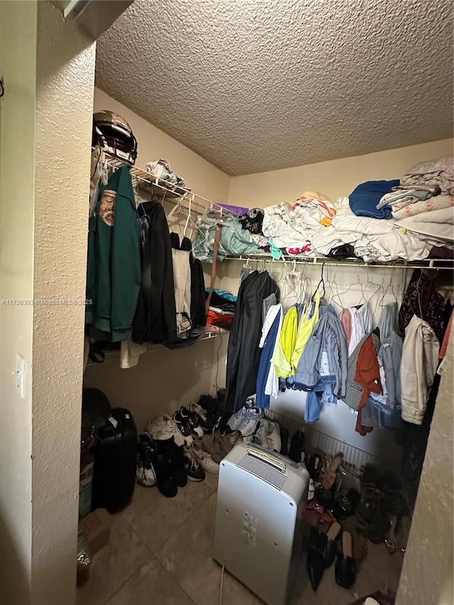 walk in closet featuring tile patterned flooring