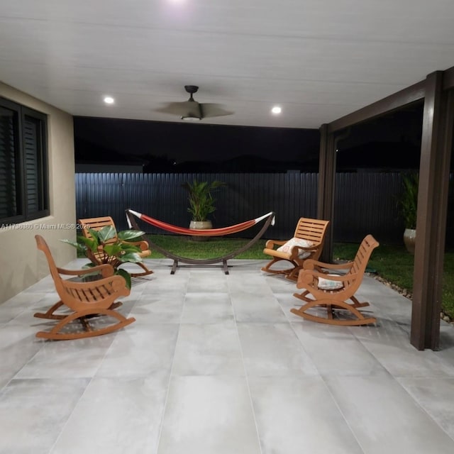 view of patio featuring ceiling fan