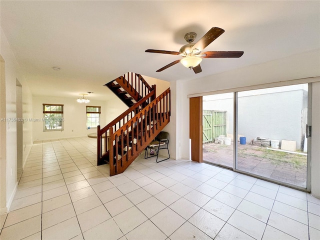 tiled living room featuring ceiling fan