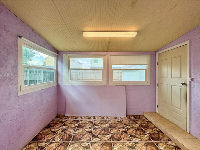 interior space with vaulted ceiling and wooden ceiling