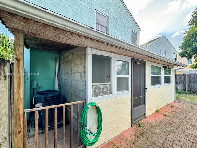 exterior space with central AC and a patio area