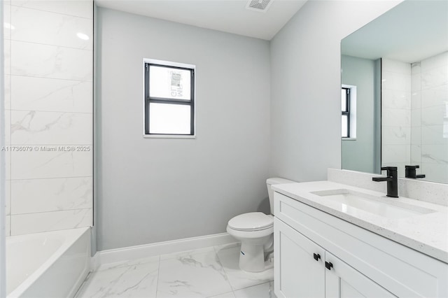 full bathroom featuring vanity, tiled shower / bath combo, plenty of natural light, and toilet