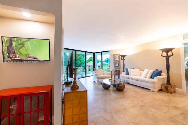 living room featuring a wall of windows