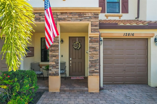 entrance to property featuring a garage