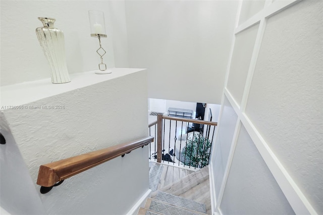 stairway featuring hardwood / wood-style flooring