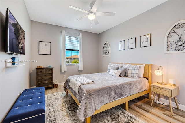 bedroom featuring ceiling fan and wood-type flooring