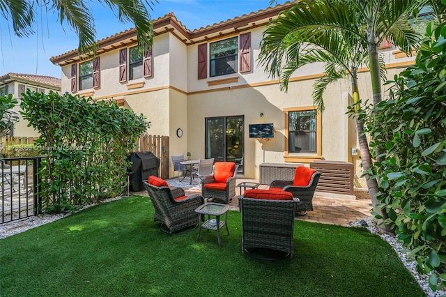 back of property featuring a yard and a patio area