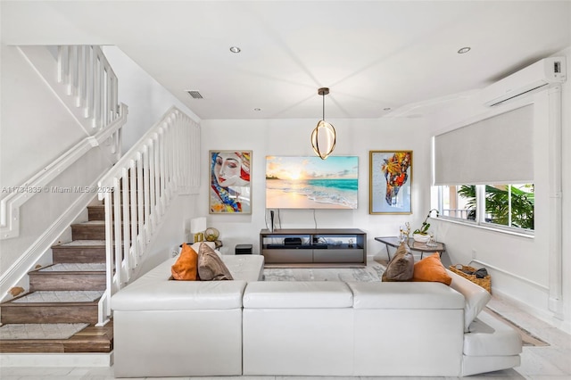 living room featuring a wall unit AC