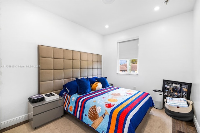 bedroom with light carpet