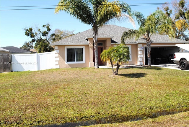 view of front of home featuring a garage and a front yard