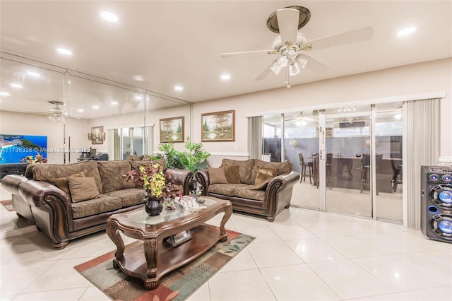 living room with ceiling fan and light tile patterned floors