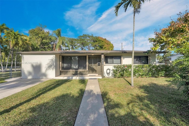 single story home featuring a front yard