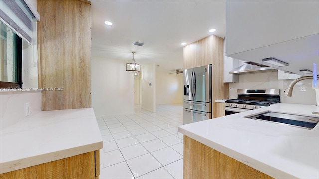 kitchen featuring pendant lighting, appliances with stainless steel finishes, light tile patterned flooring, and sink