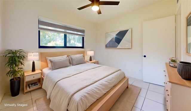 unfurnished bedroom featuring light tile patterned floors, ceiling fan, and a closet