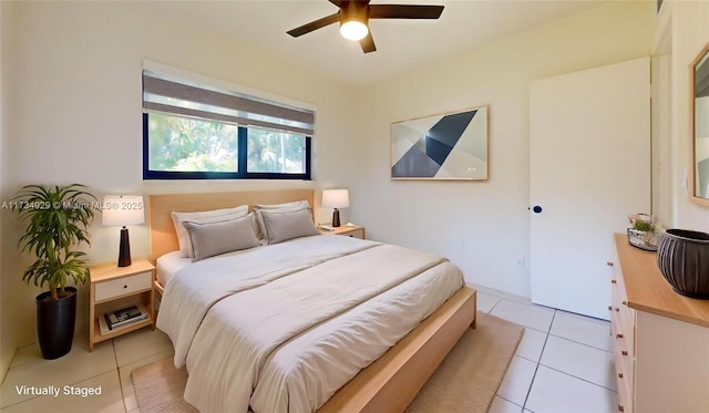 tiled bedroom with ceiling fan