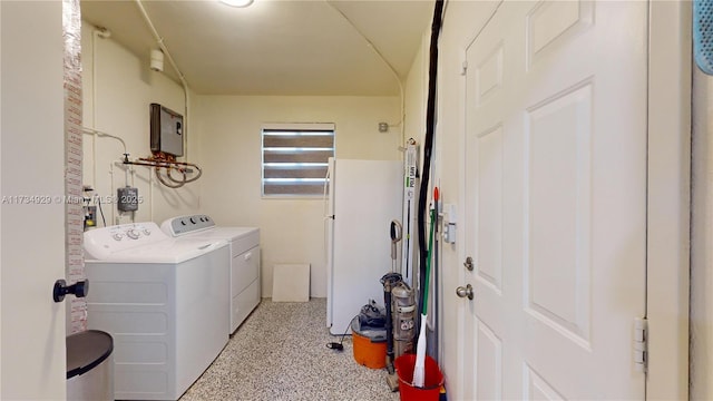 clothes washing area with washer and dryer