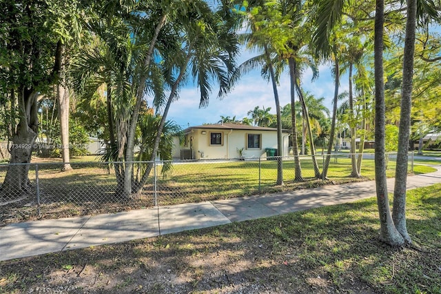 ranch-style home featuring a front yard