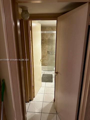 hall featuring light tile patterned flooring