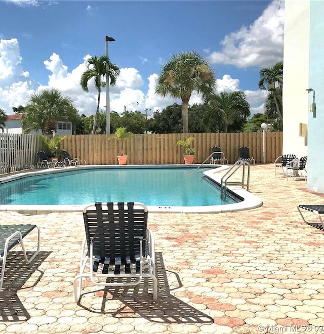 view of pool featuring a patio area