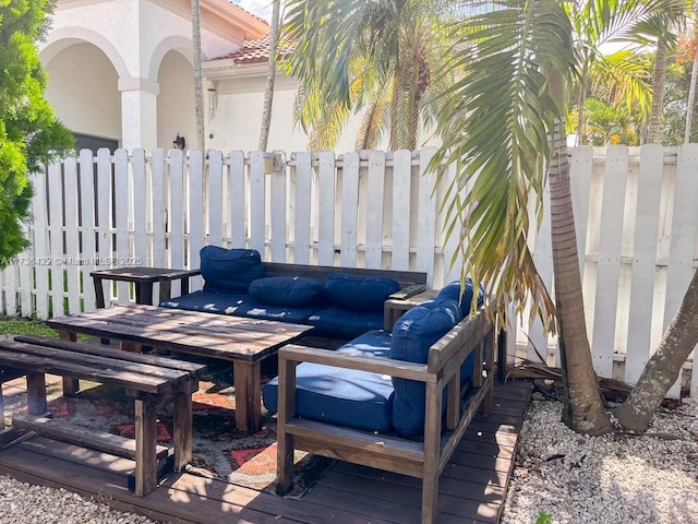 view of patio featuring fence and an outdoor hangout area