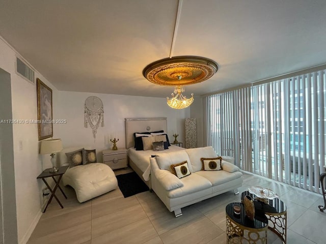 bedroom with expansive windows and light tile patterned floors