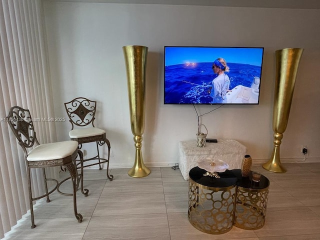 sitting room featuring tile patterned flooring